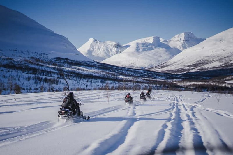 From Tromsø: Snowmobiling at Camp Tamok & Snow Park Visit - Driving your own snowmobile on guided Arctic trails
