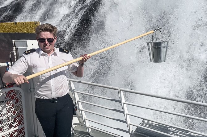 Geiranger Fjord Tour with Waterfall Tasting - Onboard comfort: air-conditioned vehicle, plus indoor shelter