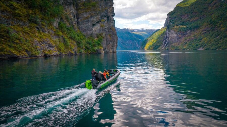 Geiranger: Guided Geirangerfjord Boat Tour - Weather reality: rain, wind, and waterfall mist