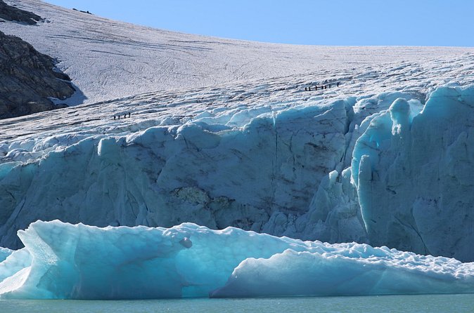 Glacier Half Day Tour on Stygge - Stepping onto the glacier arm: crampons, rope, and crevasses