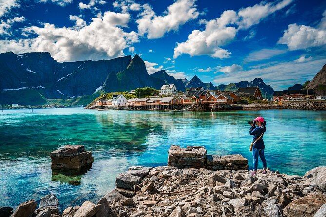 Special Summer Cruise Bus Tour of Lofoten - Sakrisøya: yellow rorbuer cabins at the end of the loop