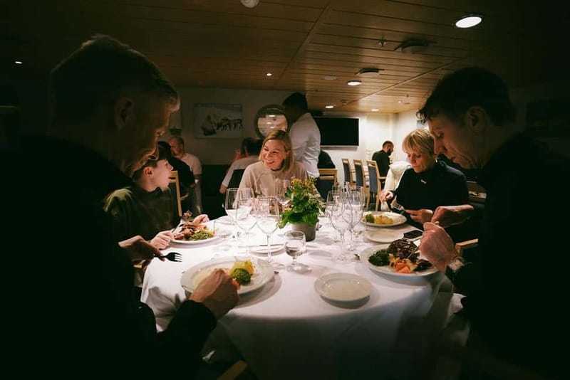 Tromsø: 24hr Northern Lights & Whale Watching Cruise - Breakfast at 08:00, fjord mountains, and a glacier ahead