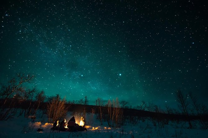 Tromso Aurora Hunt with Bonfire, Soup, Winter Gear & Transfers - Driving the Aurora Plan: Multiple Spots and Sometimes Finland