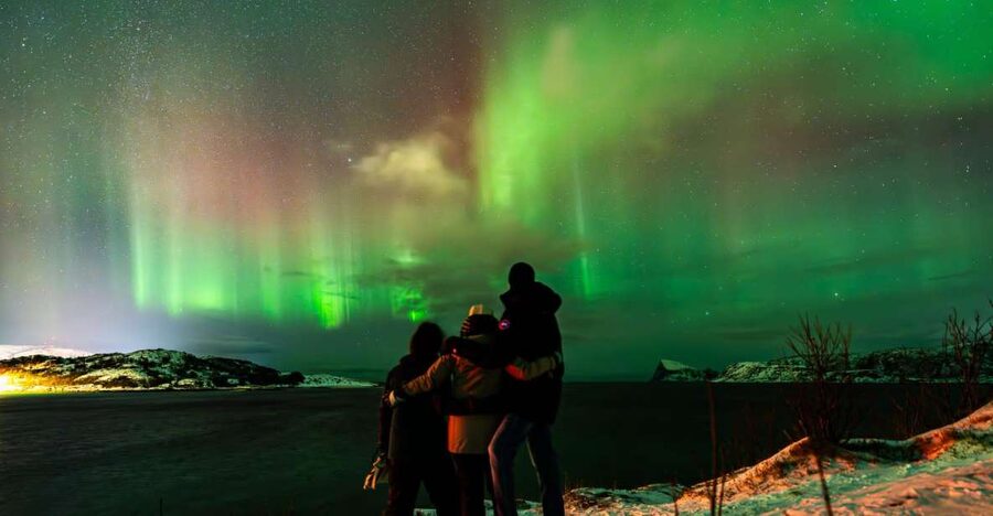 Tromsø: Small group Aurora Borealis - How your guide searches for clear sky and reads the night